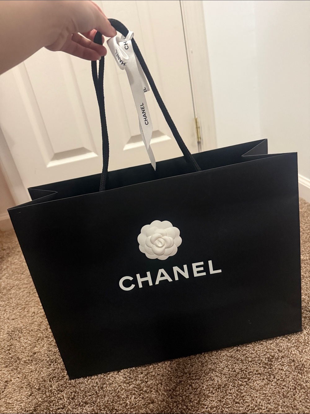 CHANEL Black and White Logo Shopping Bag with Camellia Accent
